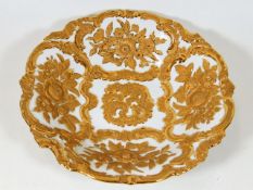A Meissen bowl with gilded decor in relief