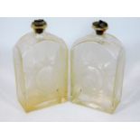 A pair of etched early 20thC. glass flasks