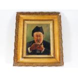 A c.1900 gilt framed oil on canvas of man eating o