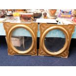 A pair of 19thC. oval gilt frame inserts