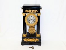 A 19thC. French portico clock with ormolu fittings