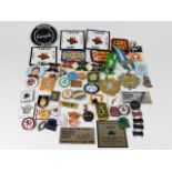 A collection of mostly motorcycle related badges,