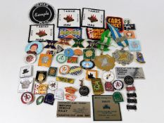 A collection of mostly motorcycle related badges,