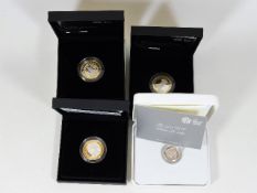 Three silver proof £2 coins & one silver £1 coin