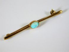A 9ct gold bar brooch with opal