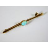 A 9ct gold bar brooch with opal