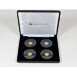 Four 9ct gold 1gm coins with box