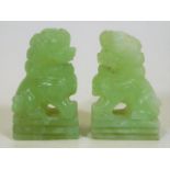 A pair of 1920's Chinese carved jade foo dogs