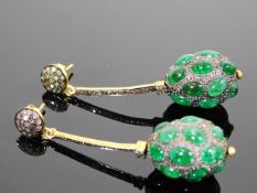 A pair of silver & gold diamond & emerald drop ear