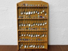 A mounted quantity of collectable silver & enamel