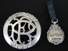 A white metal Sunbury Middlesex police badge twinn