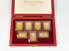 Seven gold plated silver replica commemorative sta