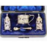 A decorative silver boxed cruet set