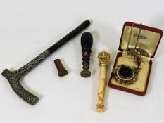 An ivory deal, a silver parasol handle & other ite
