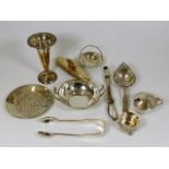 A silver tea strainer & other silver & white metal