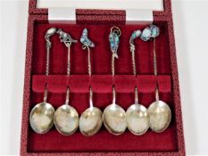 A boxed set of six spoons with opal tops