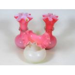 A pair of pink Victorian glass vases twinned with