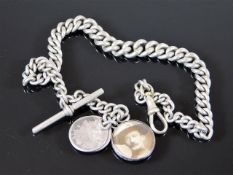A silver albert chain with double sided photo