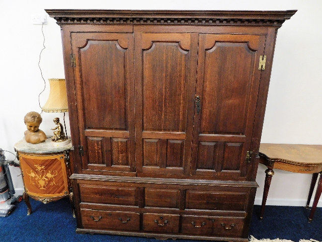 A large Georgian oak wardrobe