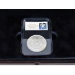 A US 1921 silver Morgan dollar, boxed