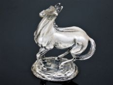A heavy solid silver 1970's model of horse after Lorne McKean with presentation box