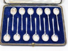 A boxed set of twelve silver teaspoons