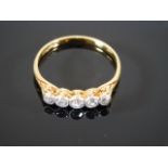 An 18ct gold ring set with five diamonds