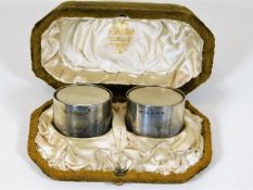 A pair of plain silver napkin rings by Frederick Elkington of Elkington & Co. in velvet box with sil