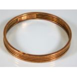 An early 20thC. 9ct gold bangle