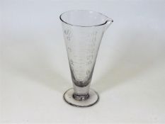 A 19thC. hand etched glass measure