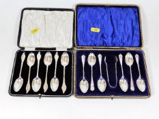 A set of six boxed silver spoons with tongs twinne