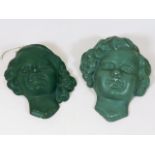 A pair of early 20thC. art deco plaster masks sign