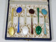 A boxed set of six enamelled spoons