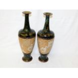A pair of Royal Doulton stoneware vases, repair to