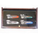 Four Harley Davidson pocket knives in display case