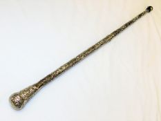 A white metal walking cane with embossed decor