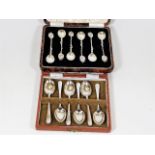 Two boxes of six silver spoons