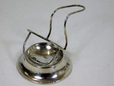 A silver pipe stand