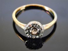 A 19thC. 18ct gold ring set with pink centre diamo