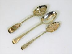 A Georgian berry spoon & two other spoons