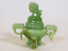 A mid 20thC. Chinese carved jade pot with cover