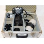 A Canon A1 camera with case, lenses & accessories