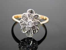 An antique 9ct gold & silver ring set with white stones