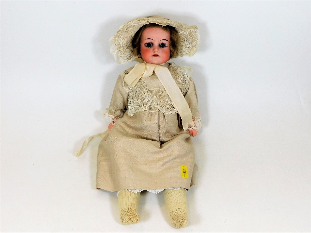 An Armand Marseille porcelain head doll
