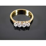 An 18ct gold ring set with four diamonds