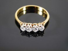 An 18ct gold ring set with four diamonds
