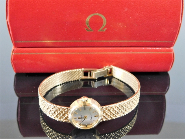 A ladies 9ct gold Omega watch & strap