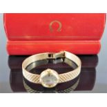 A ladies 9ct gold Omega watch & strap