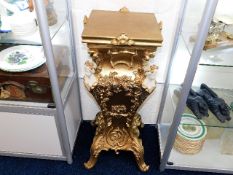 A gilt reproduction jardiniere stand