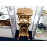 A gilt reproduction jardiniere stand